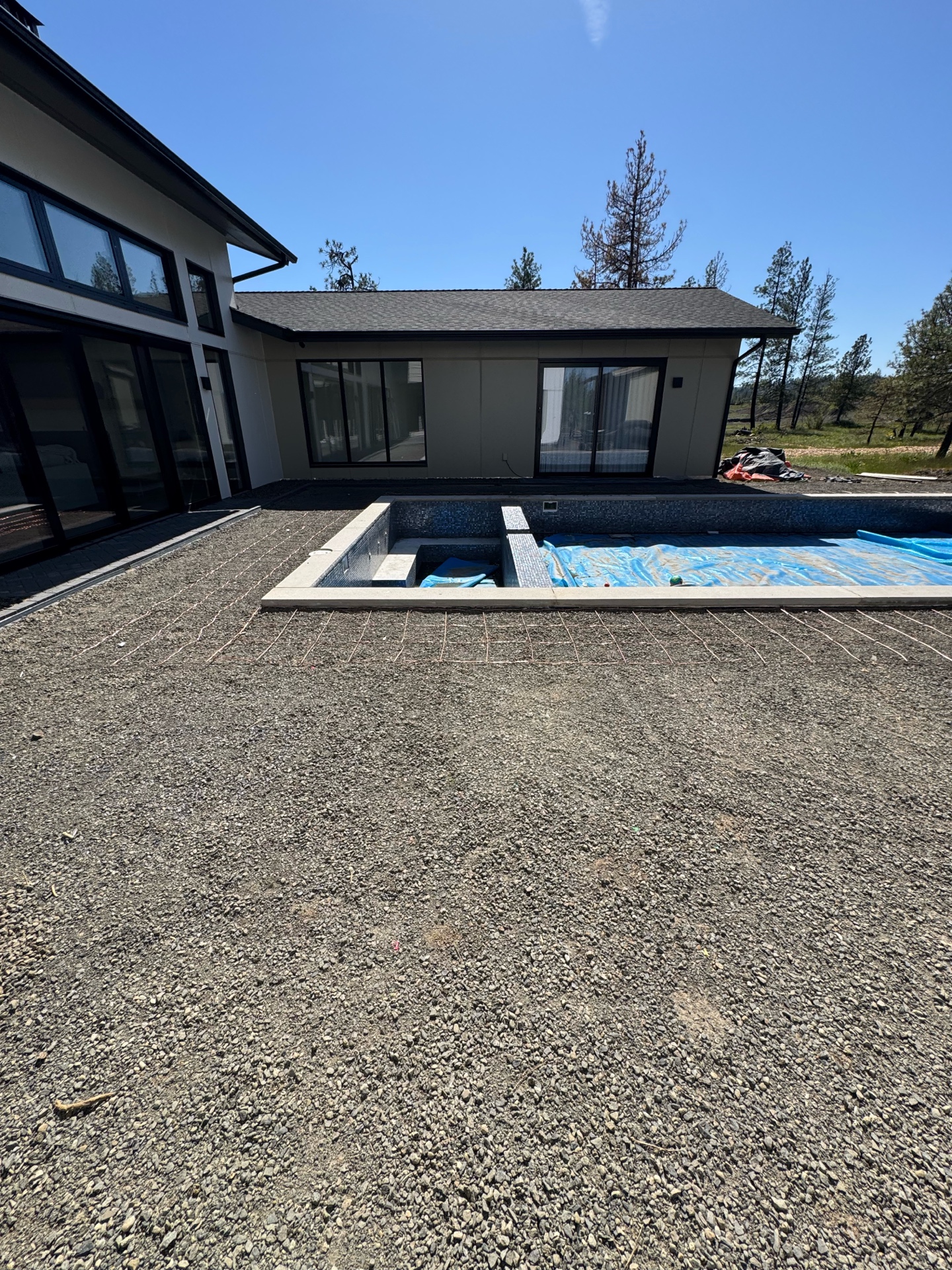 Pool house and spa from deck angle showing copper bonding grid