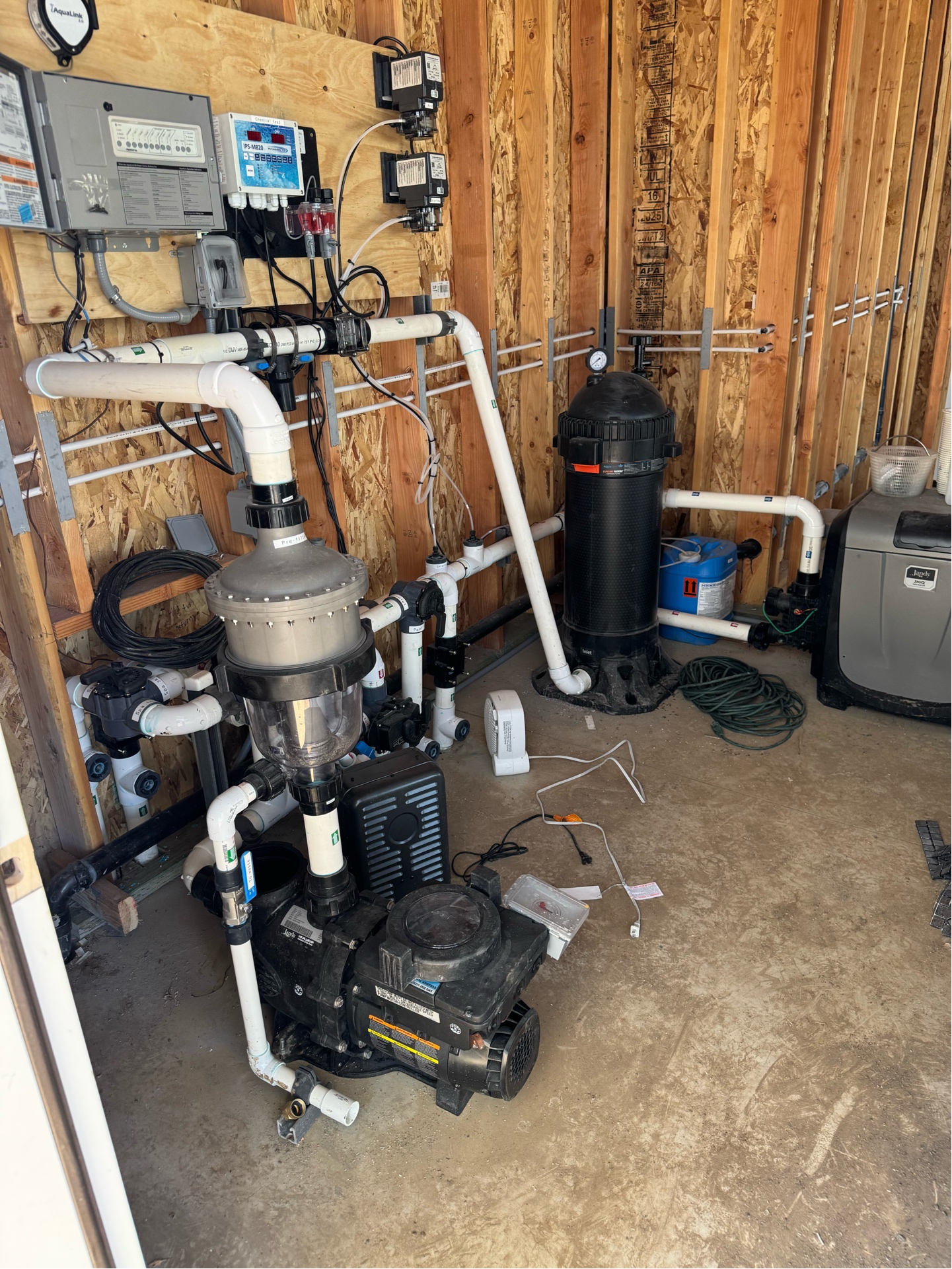 Close-up of pool equipment with variable speed pumps and automation controllers